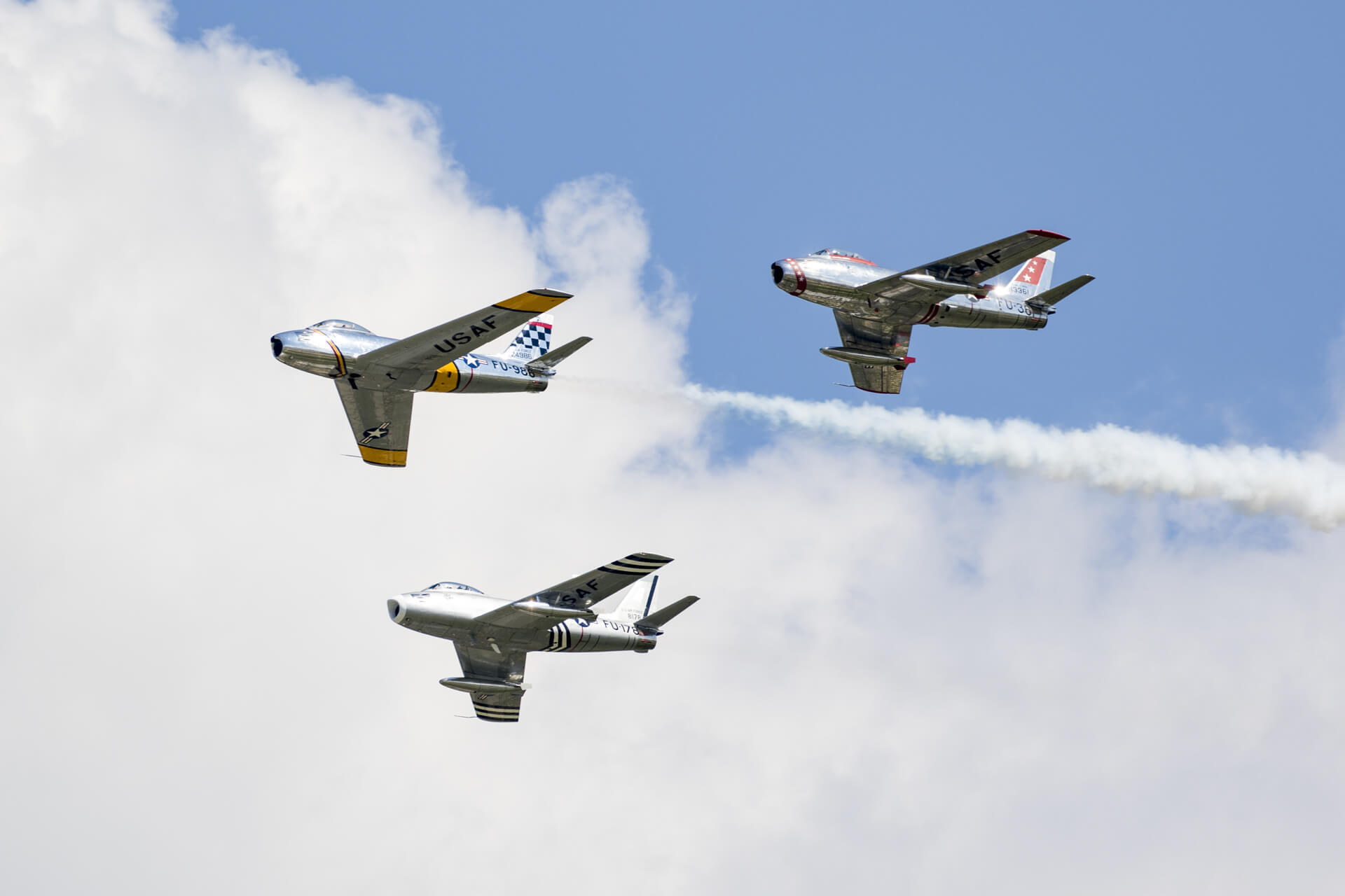Three F-86 Sabres flying in formation.