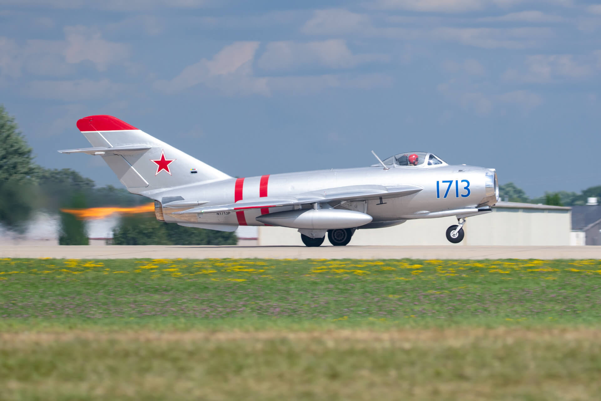 MiG-17 taking off during EAA AirVenture with it's afterburning turbojet engine throwing some heat.