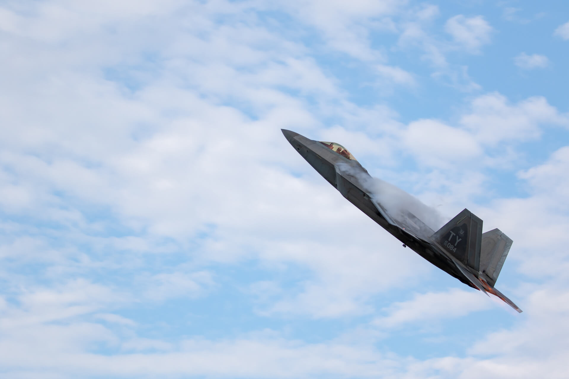 F-22 shows off high-g turn which causes vapor to form.