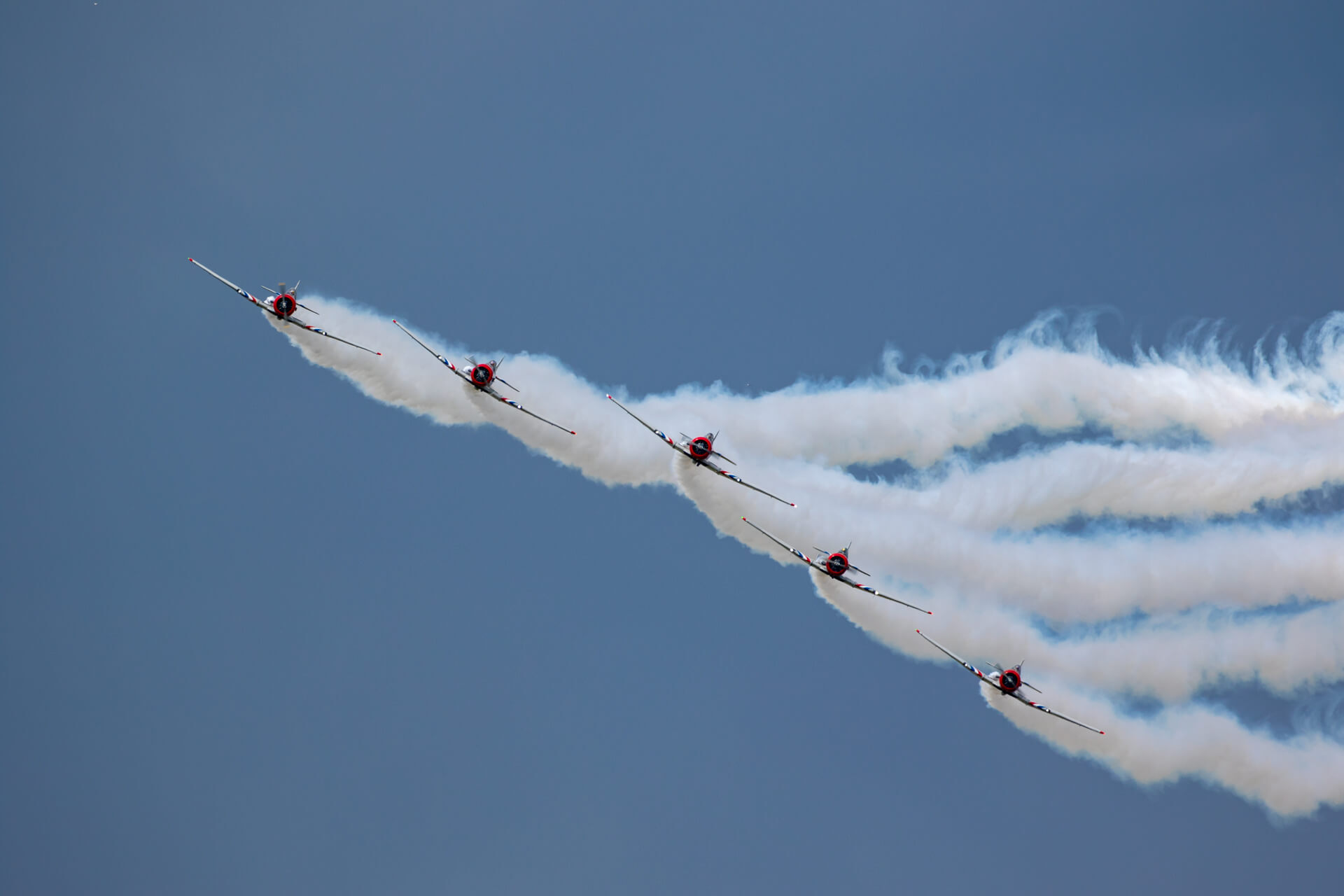 Skytypers fly in formation at EAA AirVenture 2018.