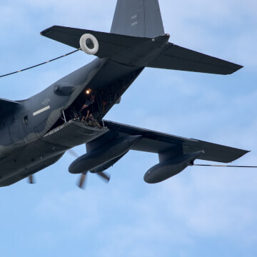 Lockheed Martin C-130J Super Hercules demonstrates refueling capabilities; while airman checkout AirVenture from above.