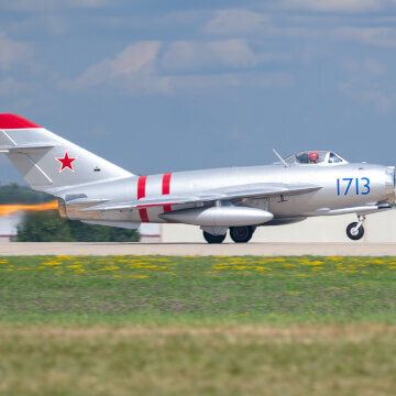 MiG-17 taking off during EAA AirVenture with it's afterburning turbojet engine throwing some heat.
