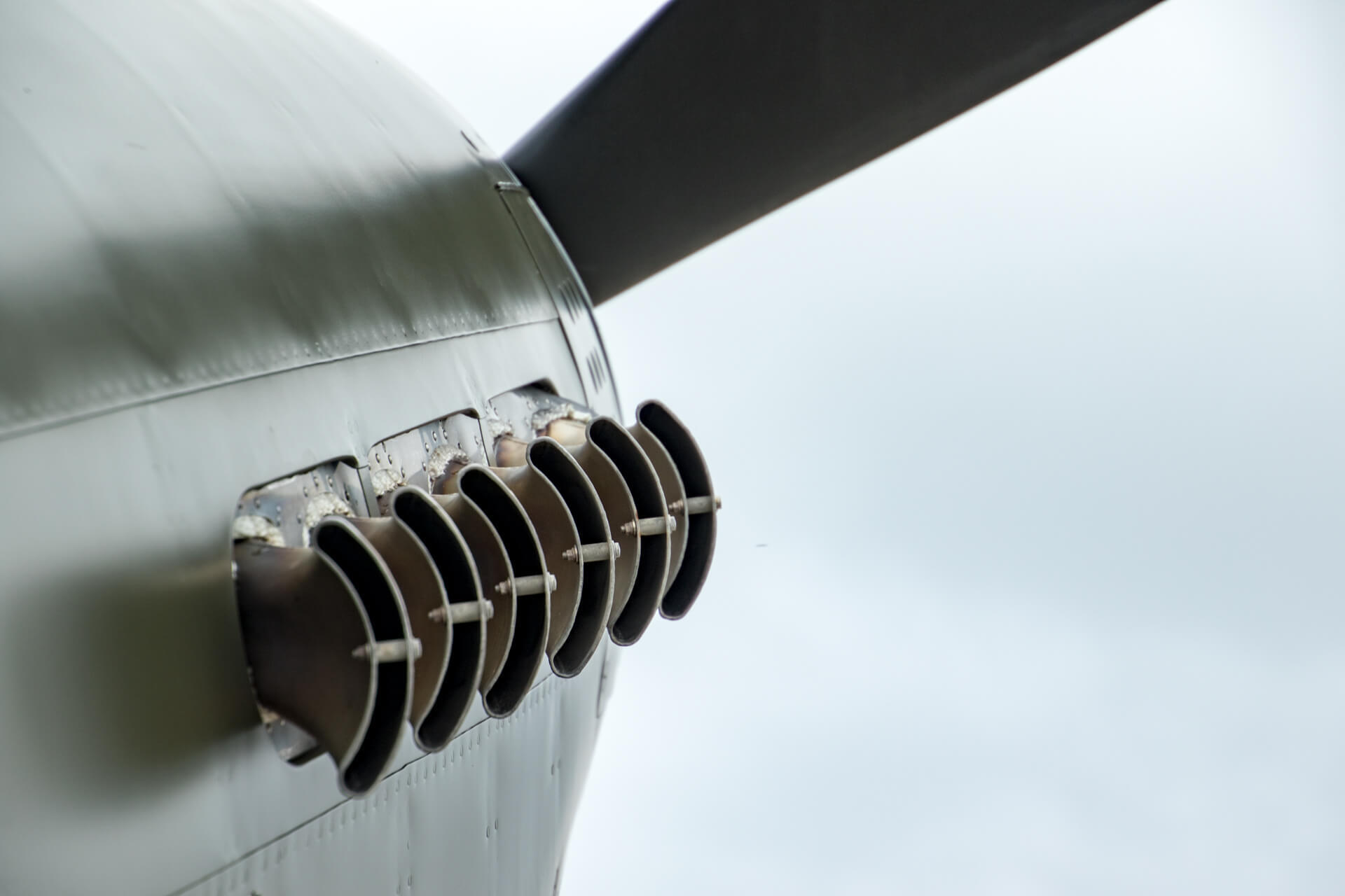Exhaust from a WWII-era prop engine plane.