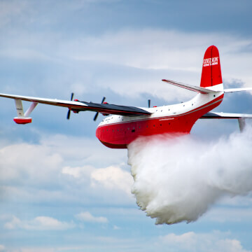 What 7,200 gallons of water leaving the back of a 70 year old plane looks like.