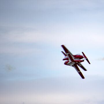 Snowbirds crossing flight paths in their CT-114s.