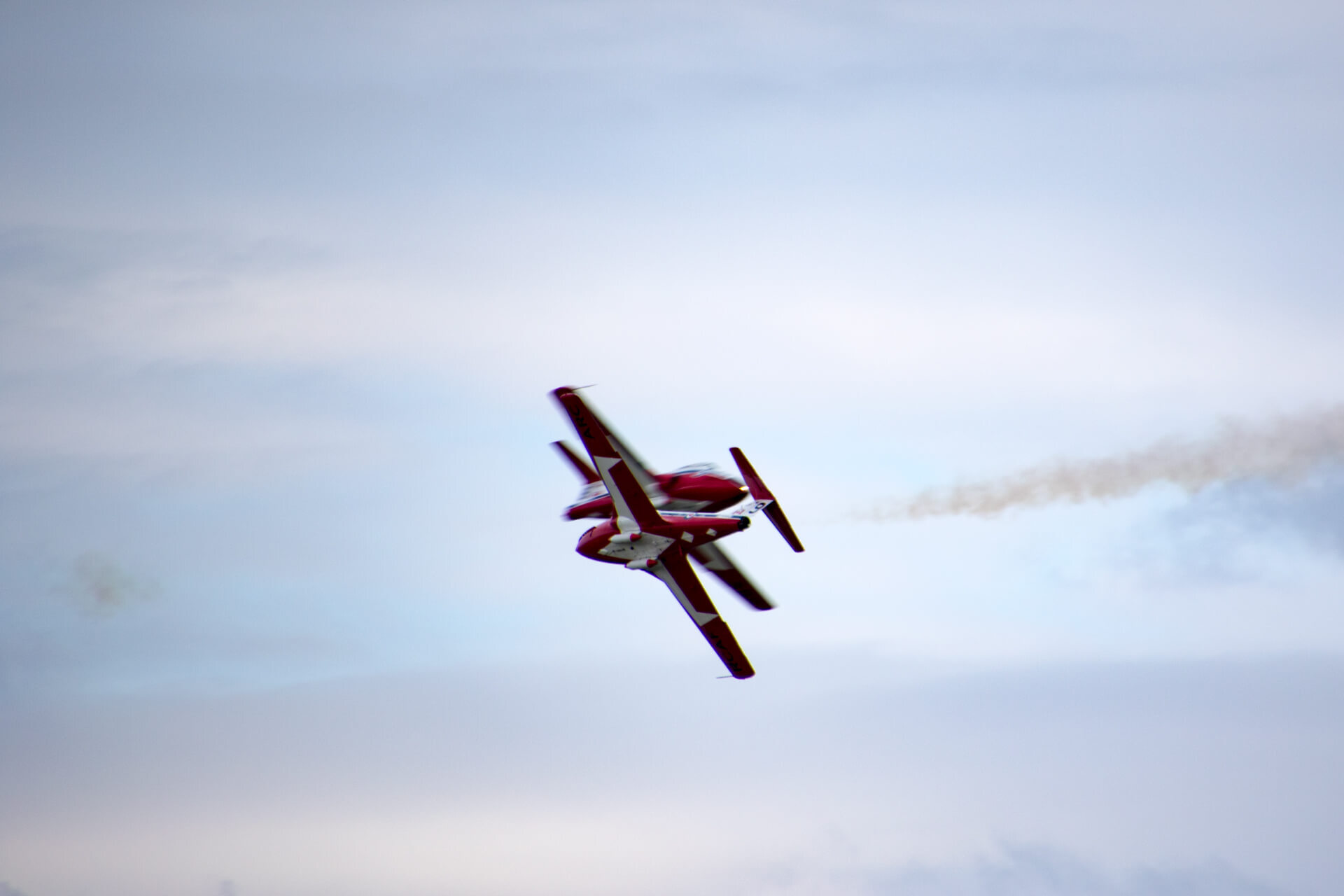 Snowbirds crossing flight paths in their CT-114s.
