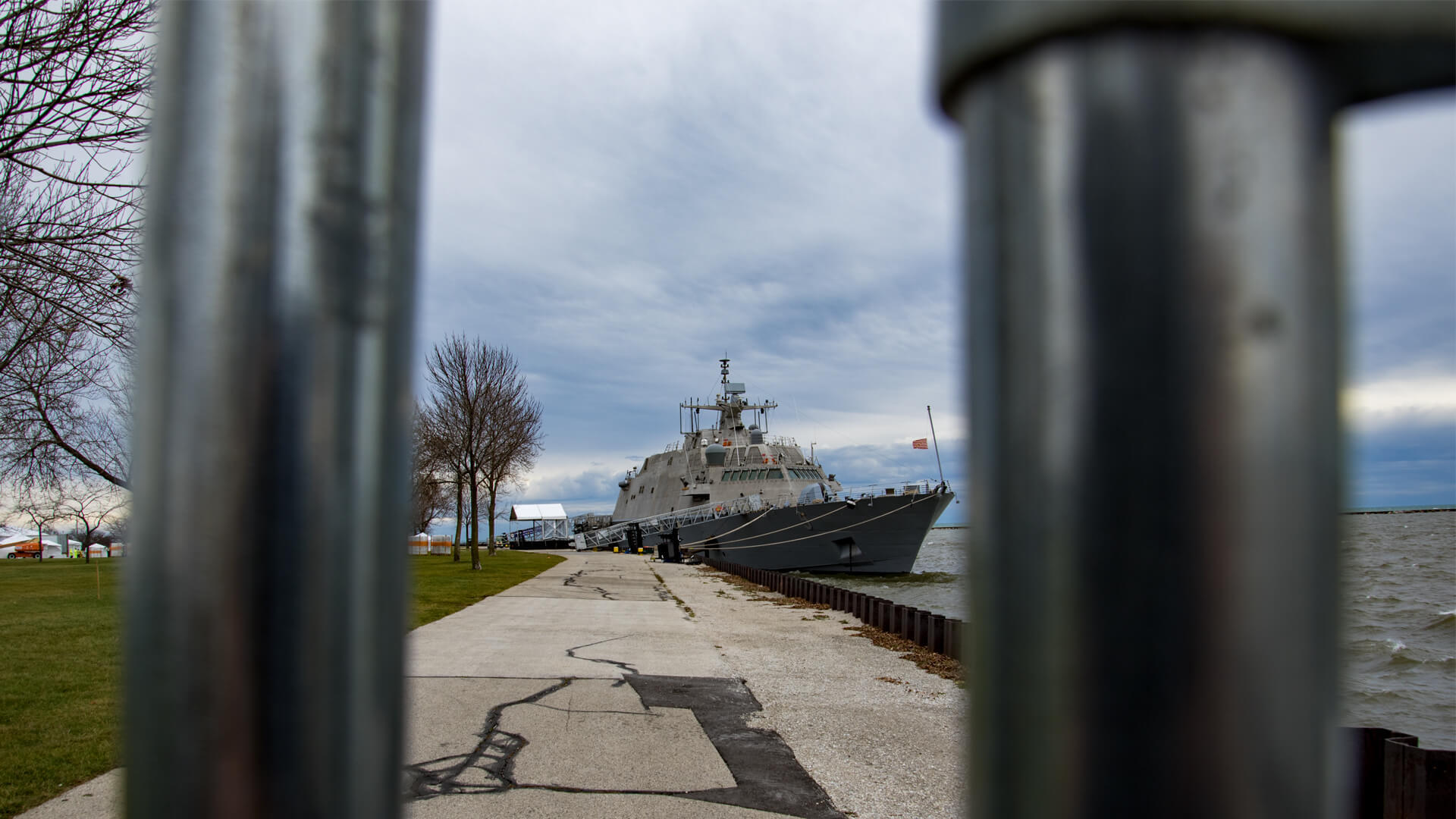 Peering through a fence at the new USS Milwaukee.