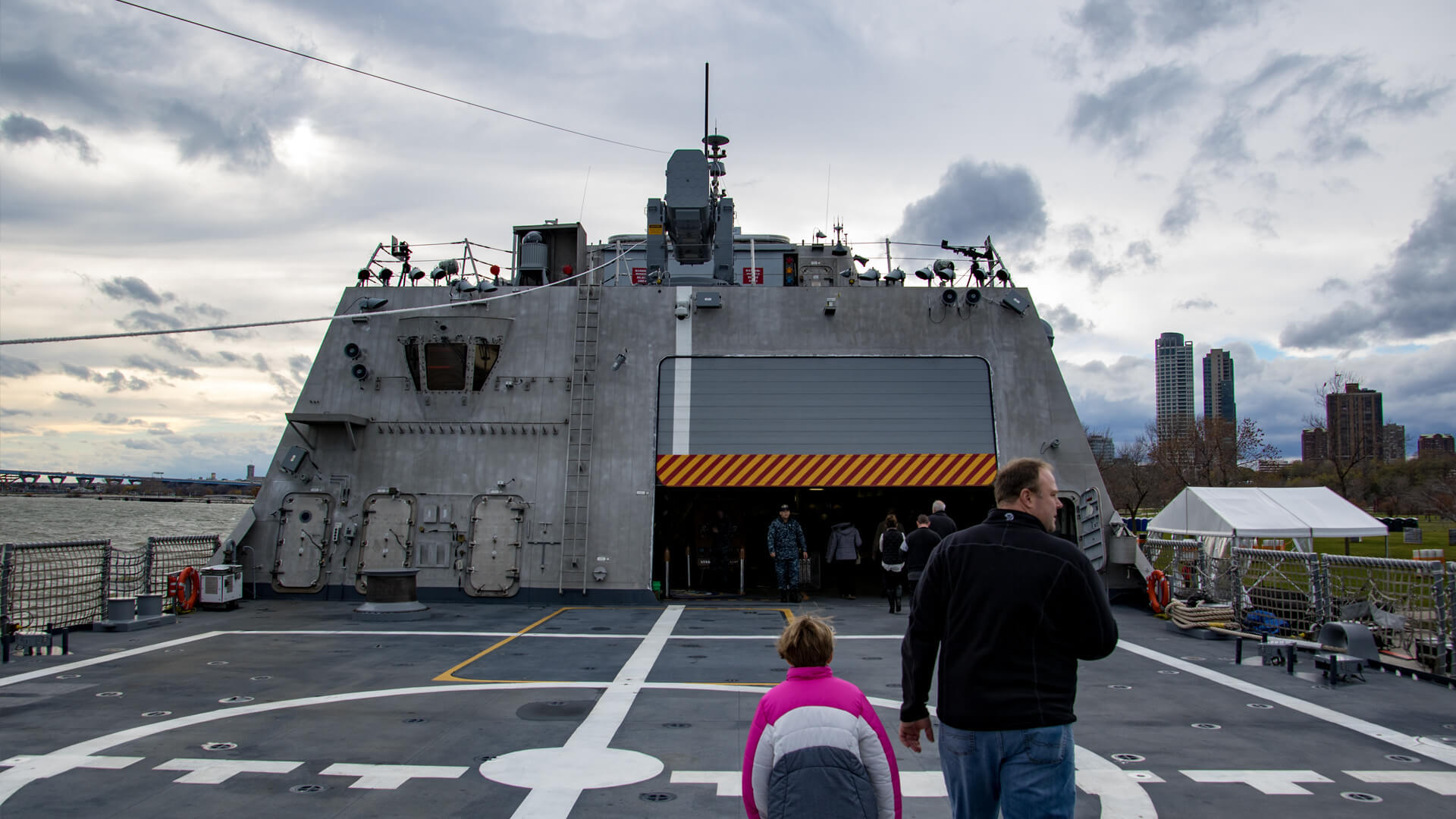 Walking the flight deck of the Independence-class littoral combat ship USS Milwaukee, through the partially open hanger door.